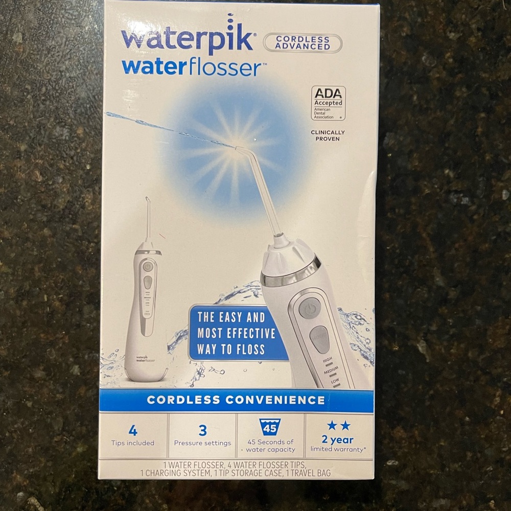 NEW IN BOX Waterpik waterflosser with 4 tips, 3 pressure settings - unopened